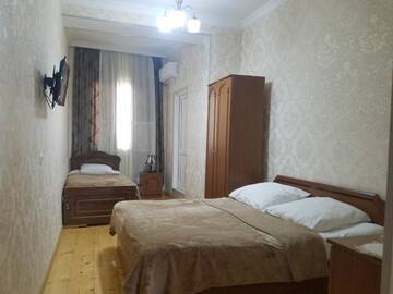 Фото номера Трехместный номер с ванной комнатой Гостевой дом Guest House Maria г. Сигнахи 4