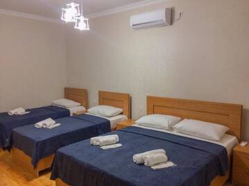 Фото номера Cемейный номер с собственной ванной комнатой Гостевой дом Guest House Maradona г. Сигнахи 2